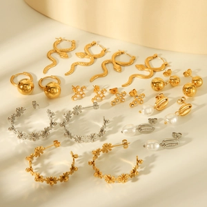 Set of gold and silver stainless steel earrings with snake, pearl, and floral motifs