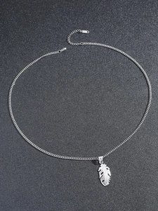 Detail of silver stainless steel feather pendant necklace with lobster clasp and chain