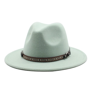Detailed view of mint green wool felt fedora with ethnic band and leather metal buckle