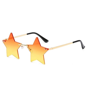 Detail view of star-shaped rimless sunglasses with orange gradient lenses and gold metal temples