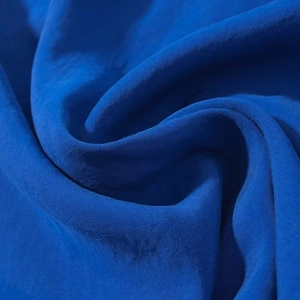 Royal blue halter midi dress in premium silky fabric with elegant drape and satin finish