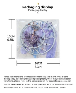 Detail of tree of life dreamcatcher with purple feathers in 16cm packaging