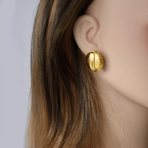 Minimalist golden stainless steel oval stud earrings with striped radial texture for women