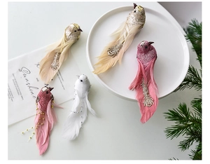 Detail of glittered foam birds with realistic feathers for Christmas tree decoration