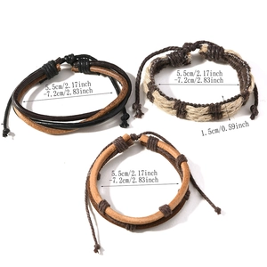 Close-up of three-piece set with brown multilayer leather and woven fiber bracelets