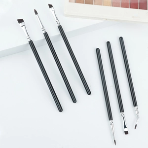 Detailed close-up of professional 6-piece eye makeup brush set with silver ferrules