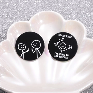 Funny black enamel pin with science quote and stick figure in a white shell dish