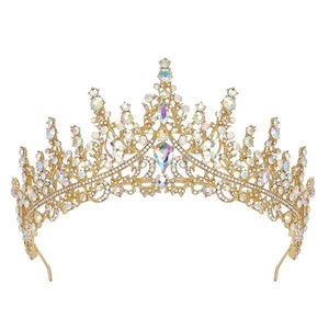Close-up of golden crown headpiece with colorful rainbow crystals for girls' formal wear