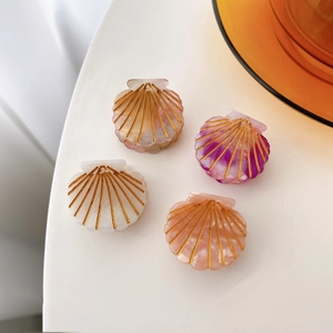 Sweet shell-shaped acetate hair clips in four colors with elegant gold textured lines