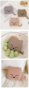 Detail of cute cat shaped wallets with embroidery and tail pendant in various colors