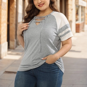 Women's plus size V-neck T-shirt with color block design and lace-up front detail