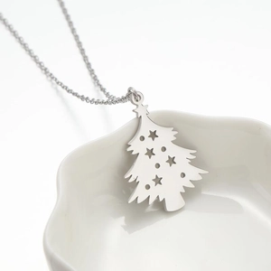 Polished stainless steel Christmas tree pendant necklace with star cutout on ceramic plate