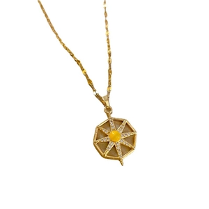 Titanium steel necklace with gold starburst pendant and yellow center stone inlay