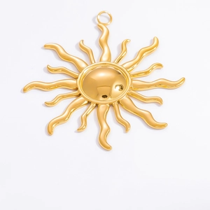 Macro shot of a 18k gold plated stainless steel sun charm pendant with polished finish