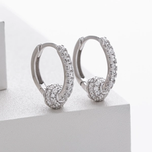 Macro shot of S925 sterling silver hoop earrings with micro-pave cubic zirconia balls