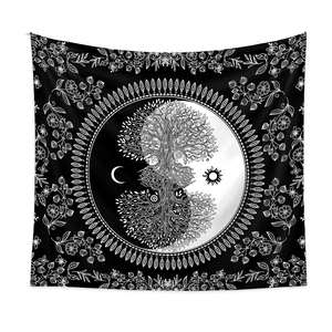 Detail of black and white bohemian tapestry featuring Tree of Life and Yin Yang sun moon
