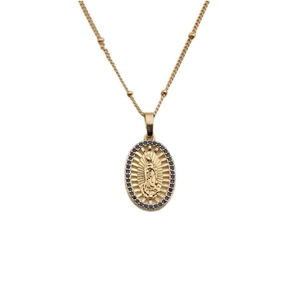 Gold pendant necklace featuring a Mary medallion surrounded by blue zirconia stones