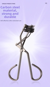 Detailed macro view of professional carbon steel eyelash curler with built-in comb teeth