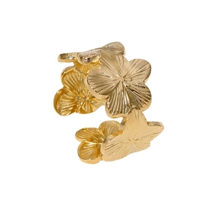 Floral stainless steel open ring with three gold-plated hollow flowers on white background