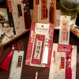 Detail of traditional Chinese bookmarks with silk tassels and blessing calligraphy