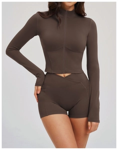 Detail of high-waist yoga shorts with crossover V-waistband and convenient side pockets