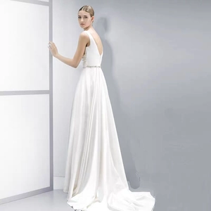 Elegant white satin wedding dress with a deep V-neck back and beaded waistline
