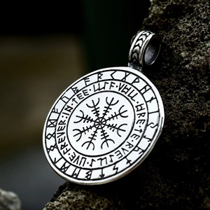 Aegishjalmur symbol Ouroboros pendant in antique silver finish on a rough stone