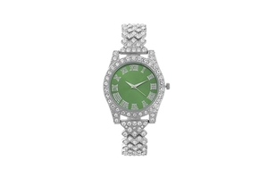 Detail of luxury women's silver watch with green dial and crystal encrusted metal band