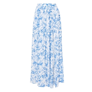 Detail of white maxi skirt with blue floral print and high waist lightweight fabric