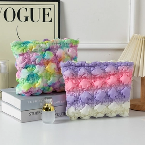 Two-piece pleated cloud bubble makeup bags in tie-dye and gradient purple stripes