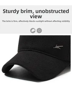 Detailed view of stiff brim and metallic geometric accent on men's thick winter cap