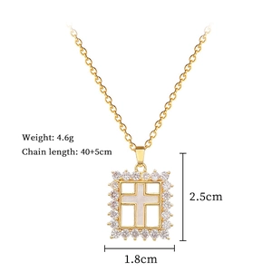 Detail view of gold titanium cross pendant with sparkling stones and size specifications