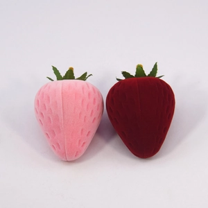 Pink and deep red strawberry-shaped jewelry boxes with soft flocking texture and leaf details