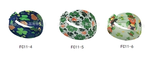 Three St. Patrick's Day headbands with clover and leprechaun prints in a wide knotted style