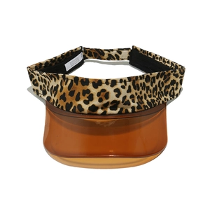 Detail of adjustable leopard print sun visor with translucent orange TPU brim and velcro