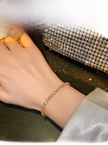Macro shot of a brilliant zircon tennis bracelet with adjustable drawstring closure
