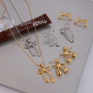 Elegant 18k gold and silver stainless steel bow knot and heart earrings set for women