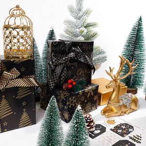 Premium black and gold Christmas wrapping paper with festive trees and snowflake patterns