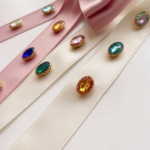 Elegant Korean style bow hair clip with pink ribbons and colorful oval gemstones
