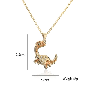 Detailed view of gold dinosaur pendant showing size 2.5cm height and weight 5g