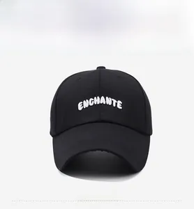 Detailed view of the white ENCHANTE 3D embroidery on a black twill baseball cap