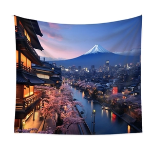 Detail of bohemian tapestry featuring Mount Fuji and cherry blossoms hanging on white wall
