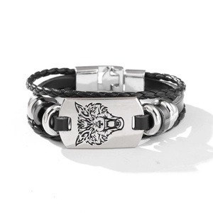 Braided black leather bracelet for men with silver wolf head metal plate on white background