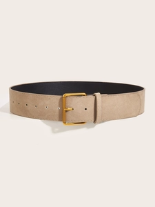 Detailed shot of retro wide khaki waist belt with matte texture and gold buckle