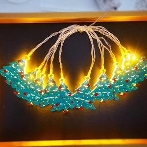 Festive Christmas tree LED string lights with warm glowing green iron tree ornaments