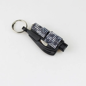 Detail of diamond-studded 2-in-1 emergency car window breaker and seatbelt cutter