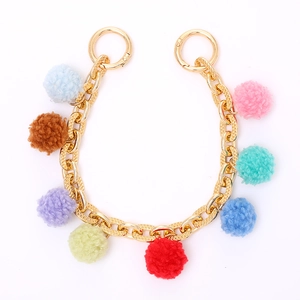 Gold metal chain strap featuring colorful plush balls for handbags and keys