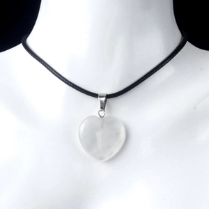 Detail of a 20mm heart-shaped white natural crystal pendant on a black cord necklace
