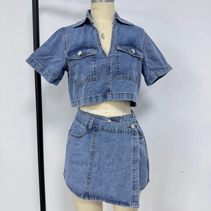Detailed macro view of retro light blue denim two-piece set showing texture and collar