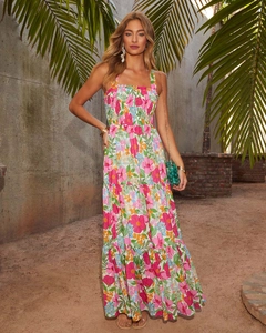 Detail of tiered floral maxi dress with vibrant pink and orange tropical pattern